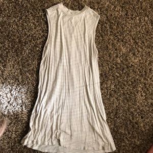 No sleeve, high necked dress